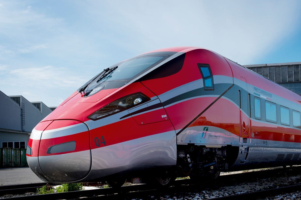 Train Frecciarossa 1000 under construction, future high -speed train from Trenitalia, on a construction site. This ETR 1000 model, designed by Bombardier and built by Ansaldo Breda, will reach 380 km/h and connect Milano to Rome in less than two and a half hours. Train Frecciarossa 1000 under construction, future high -speed train from Trenitalia, on a construction site. This ETR 1000 model, designed by Bombardier and built by Ansaldo Breda, will reach 380 km/h and connect Milano to Rome in less than two and a half hours.