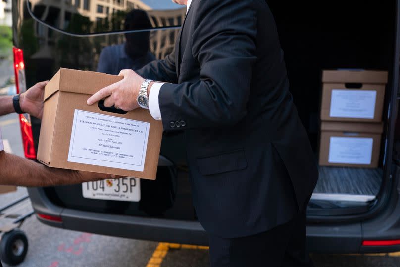 Document boxes in a vehicle after the first day of a historic antitrust trial on Meta CEOs, Mark Zuckerberg