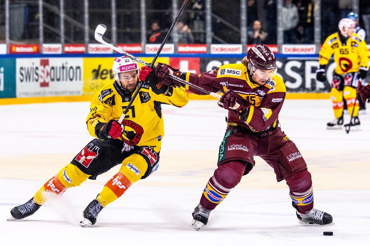 Simon Moser ice hockey player from SC Bern and Sami Vatanen from Genf Servette in action during a Swiss National League match. Simon Moser ice hockey player from SC Bern and Sami Vatanen from Genf Servette in action during a Swiss National League match.