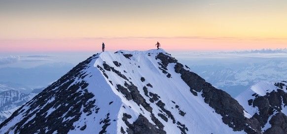 Nicolas Hojac and Philipp Brugger reach the summit of the Eiger as the sun begins to rise on April 05, 2025. // John Thornton / Red Bull Content Pool // SI202504140505 // Usage for editorial use only ...