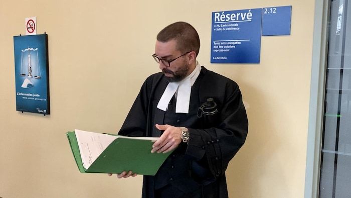 Dressed in his toga, he consults a document