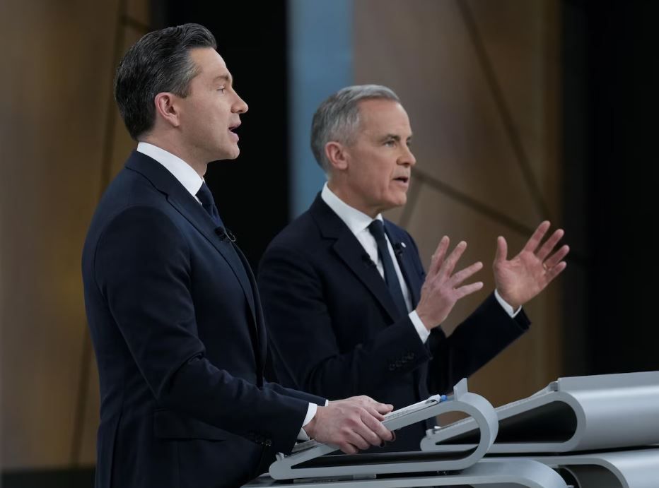 The two men speak on the set of the debate.