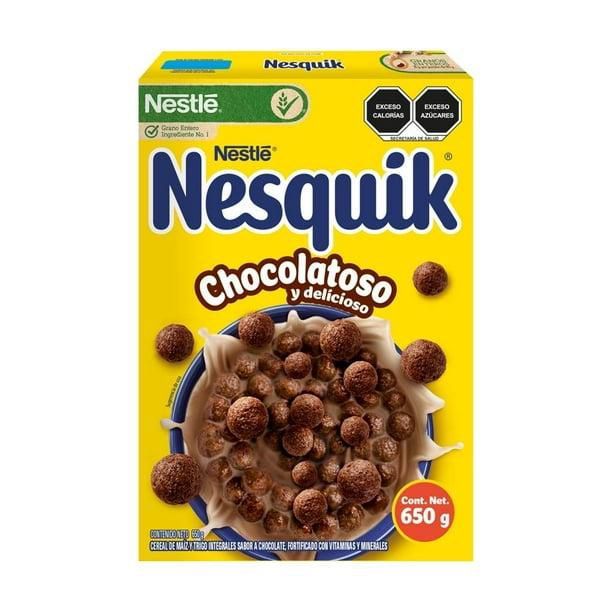 Box of 650 g chocolate nesquik cereal with bowls filled with chocolate cereal balls. Box of 650 g chocolate nesquik cereal with bowls filled with chocolate cereal balls.