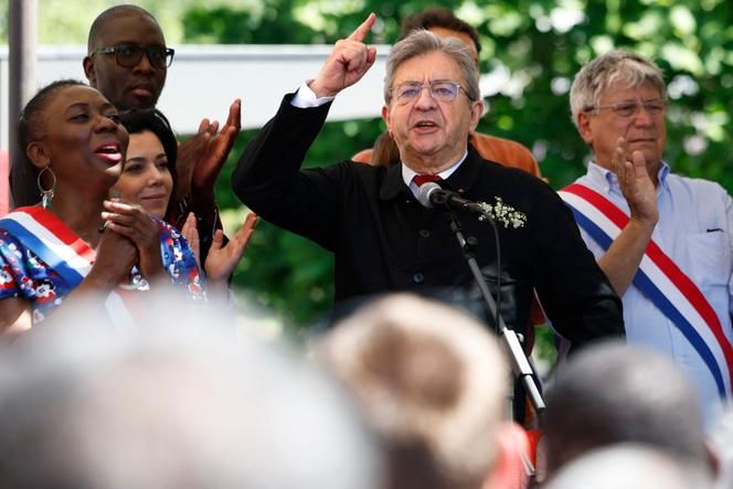 Jean-Luc Mélenchon, surrounded by