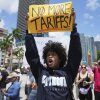 Paul Ivanov chants during a protest against the Trump administration on Saturday in Miami.