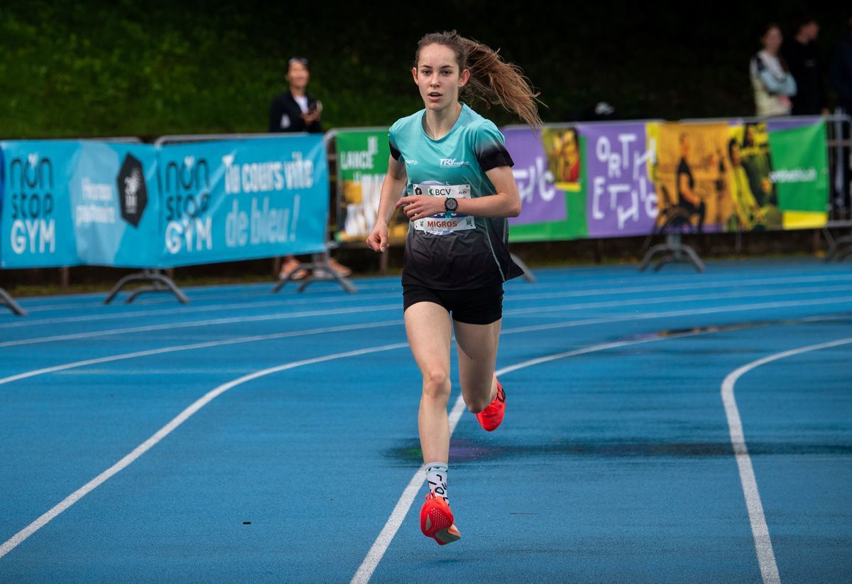 Aimie Decrausaz, a runner, crosses the finish line during the 4 km women race at 20 kilometers from Lausanne 2025. Aimie Decrausaz, a runner, crosses the finish line during the 4 km women race at 20 kilometers from Lausanne 2025.