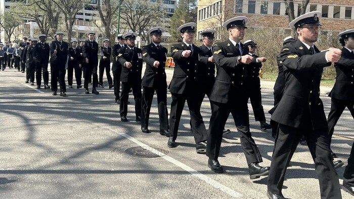 People dressed in Canadian Marine Directors paraded on May 4, 2025 in Saskatoon.