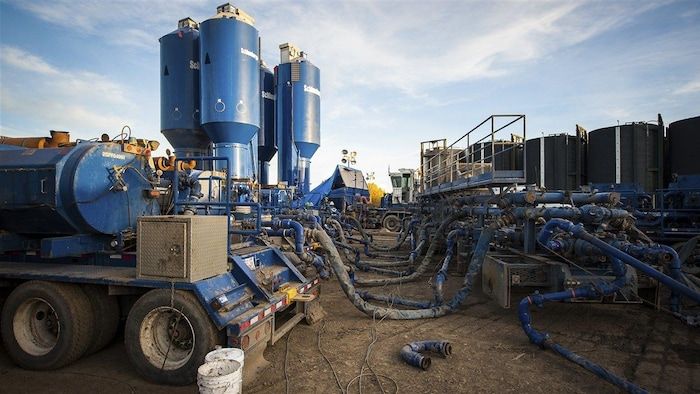 Tank trucks are obtaining the conducts of a shale gas production center in Dawson Creek, northeast of British Columbia.