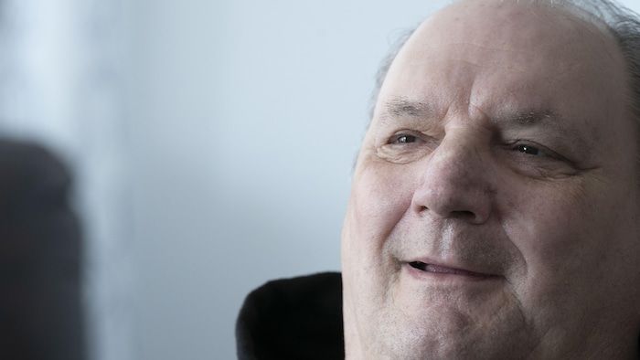 Norman Meunier, smiling.
