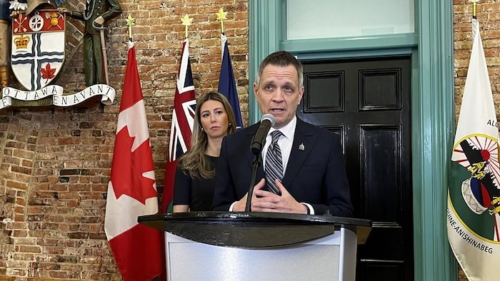 Mark Sutcliffe and Maude-Marquis-Bissonette at a press conference.