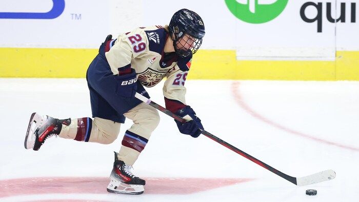 A hockey player skates with the washer.
