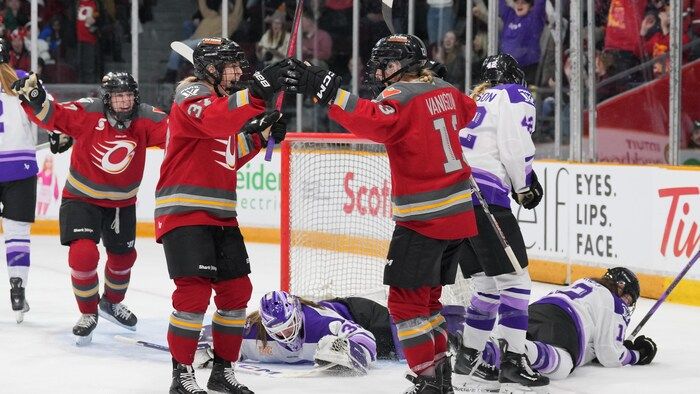 Rebecca Leslie and Tereza Vanišova raise her arms to celebrate a goal.