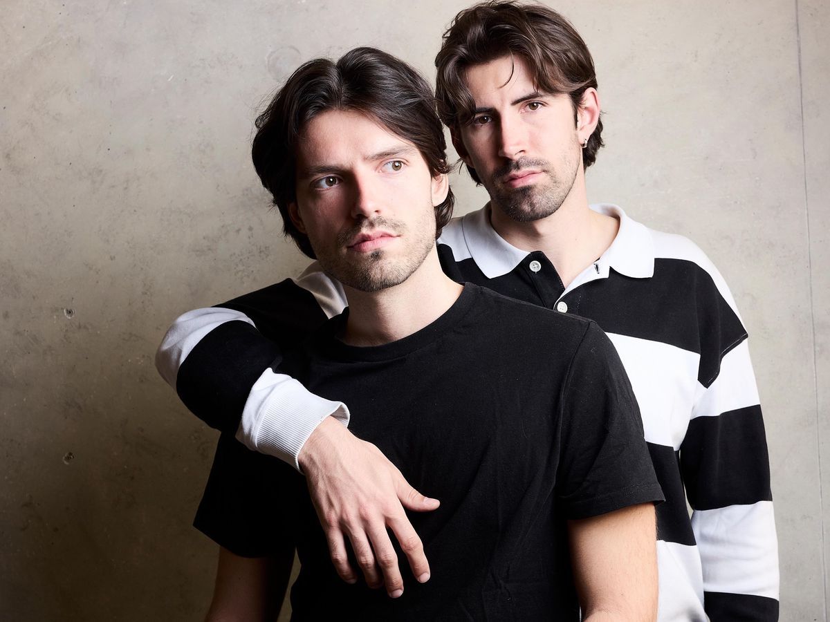 Benjamin Bühler and Evan Gusto, creators of the Evanbenjamin brand in Paris, posing together. Famous Romands Swiss stylists. Benjamin Bühler and Evan Gusto, creators of the Evanbenjamin brand in Paris, posing together. Famous Romands Swiss stylists.