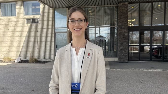The mayor of Timmins, Michelle Boileau, in a beige jacket standing in front of the camera.