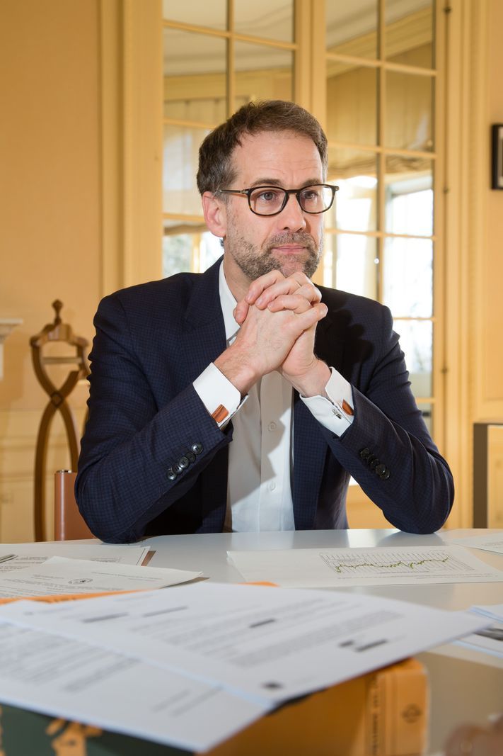 Antonio Hodgers, State Councilor, interviewed in his office in Geneva, March 5, 2025, seated at a table with documents. Antonio Hodgers, State Councilor, interviewed in his office in Geneva, March 5, 2025, seated at a table with documents.