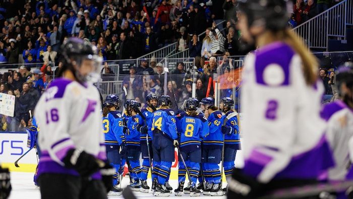 Players celebrate their victory in front of their opponents, disappointed.