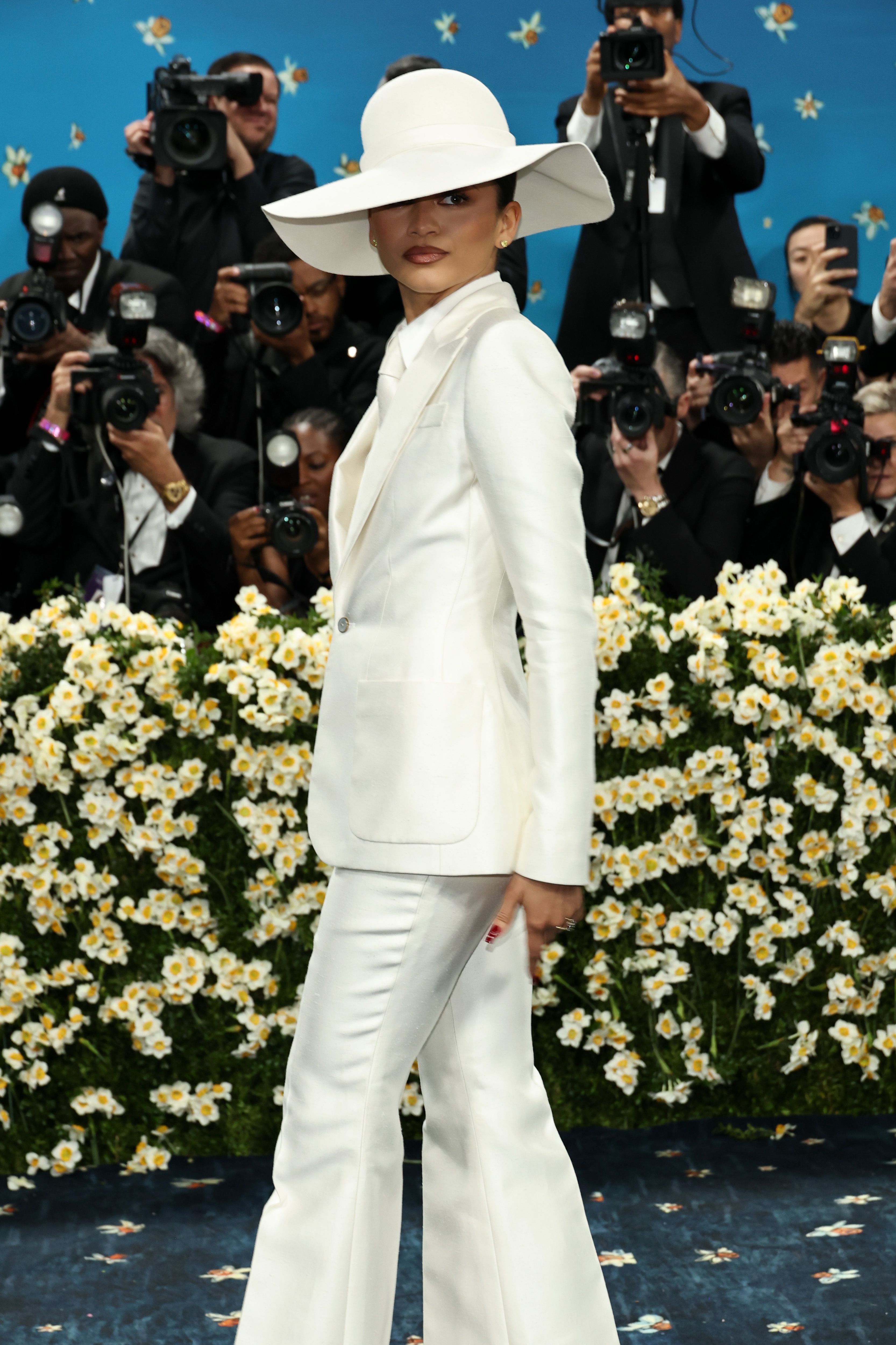 Zendaya at the 2025 met gala in a white suit