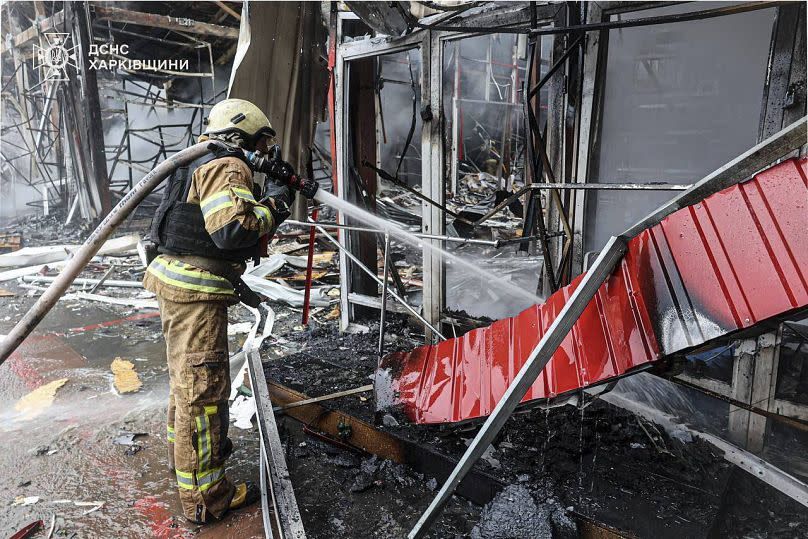Rescuers put out a fire in a building targeted in Kharkiv on May 6, 2025.