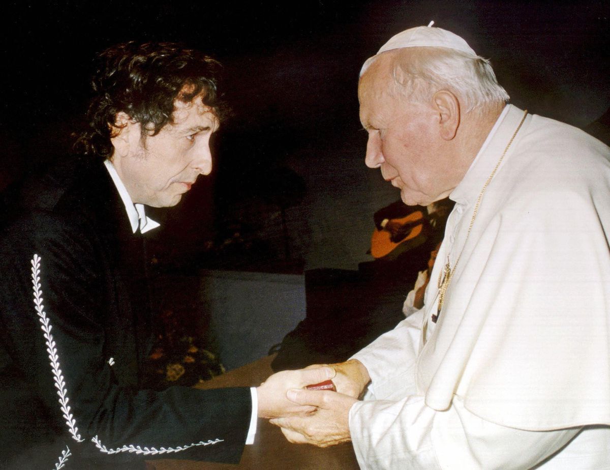 Pope John Paul II welcoming singer Bob Dylan after his performance during a concert in Bologna, September 27, 1997, broadcast by the Vatican. Pope John Paul II welcoming singer Bob Dylan after his performance during a concert in Bologna, September 27, 1997, broadcast by the Vatican.