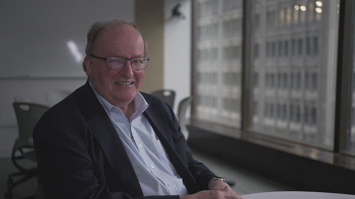Portrait of John Gradek in an office.