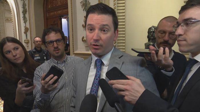 Simon Jolin-Barrette speaks with journalists.
