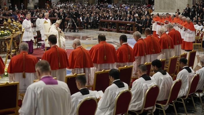 Pope Francis prays in front of new Cardinals during consistory inside St. Peter's Basilica, at the Vatican, Saturday, Aug. 27, 2022. Pope Francis has chosen 20 men to become the Catholic Church's newest cardinals. (AP Photo/Andrew Medichini)