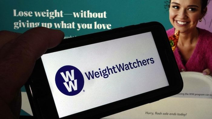Weightwatchers' logo on a mobile phone.