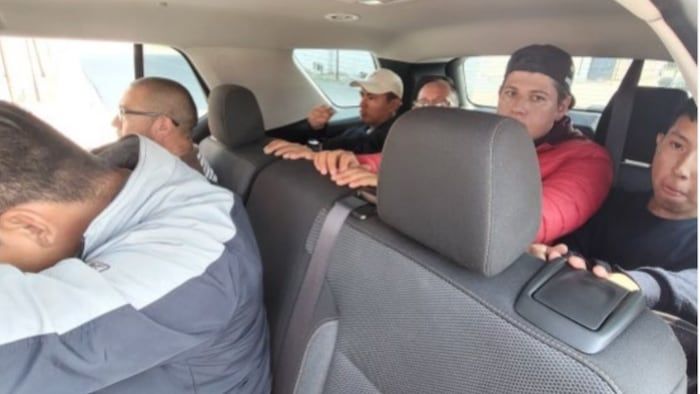 Migrants in a car.