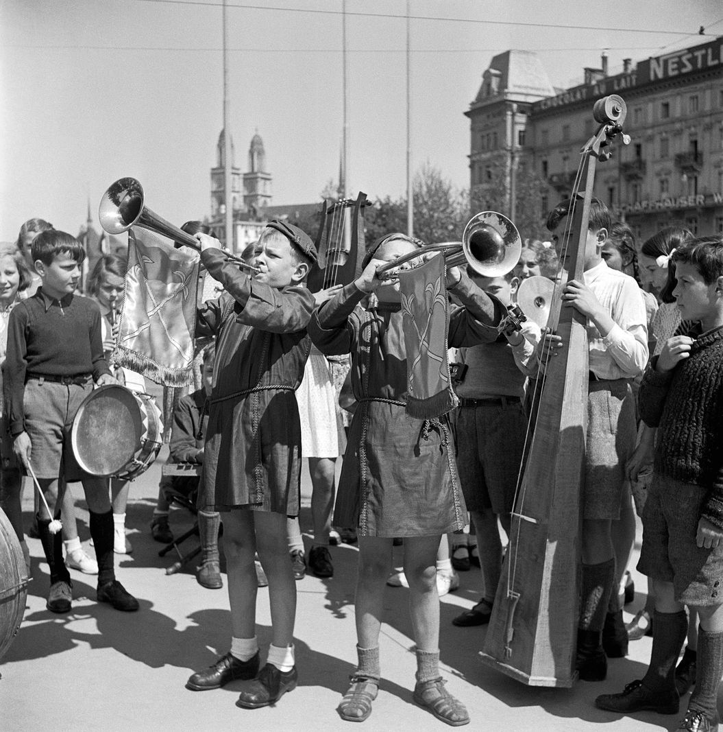 Children play musical instruments at the Stadthausquai in Zurich, May 8, 1945 to collect donations for the 'Swiss donation'. Children play musical instruments at the Stadthausquai in Zurich, May 8, 1945 to collect donations for the 'Swiss donation'.