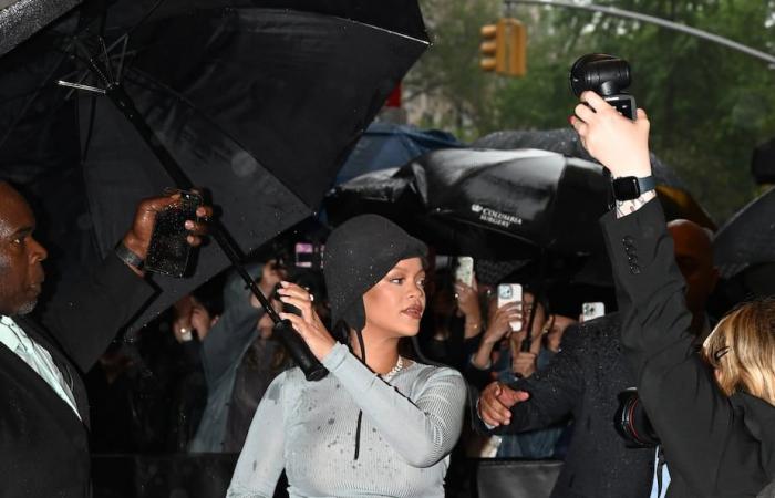 Rihanna unveils a surprise baby bump on the way to the Met Gala
