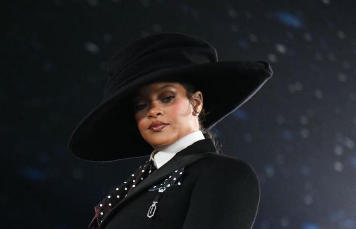 Rihanna unveils a surprise baby bump on the way to the Met Gala