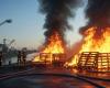 Firefighters control a palette fire
