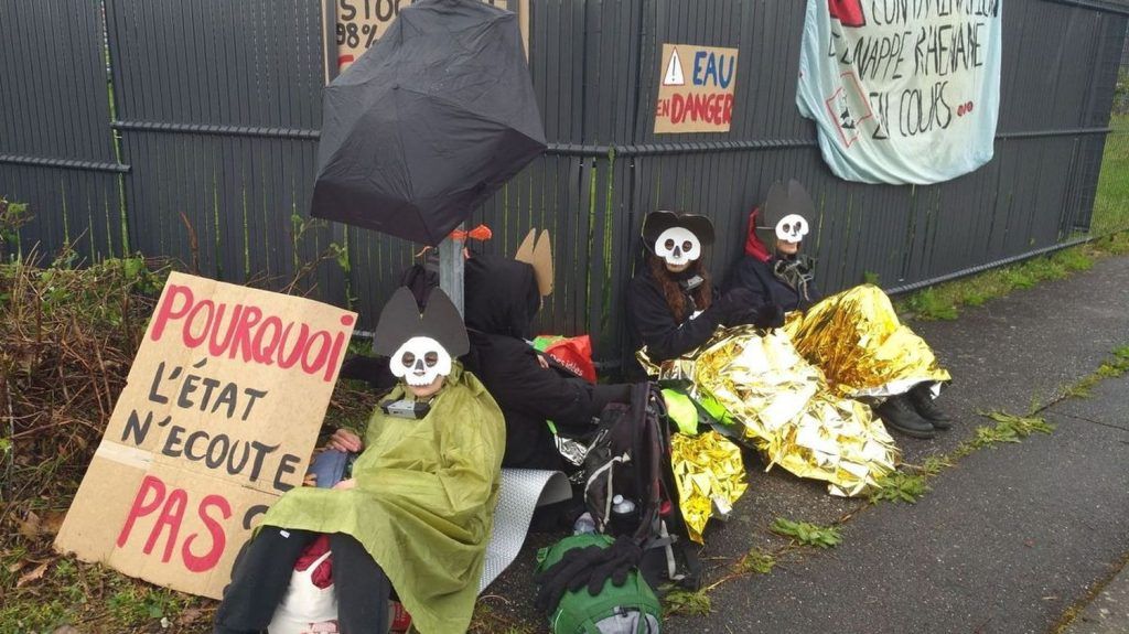 Extinction Rebellion activists still attached to the gates of the Stocamine toxic waste storage site