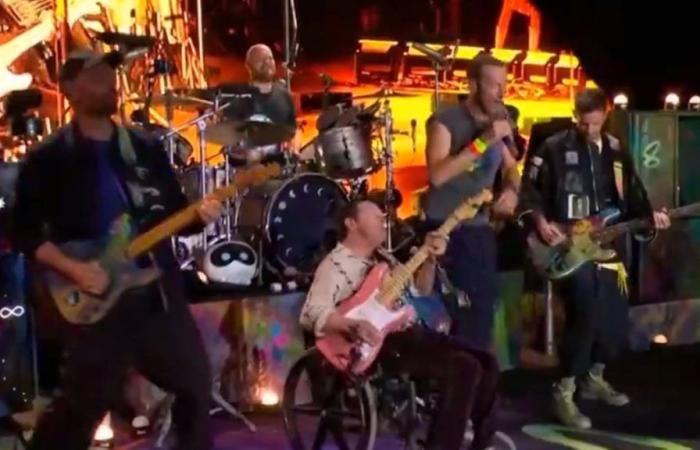 Michael J. Fox performs in wheelchair with Coldplay at Glastonbury