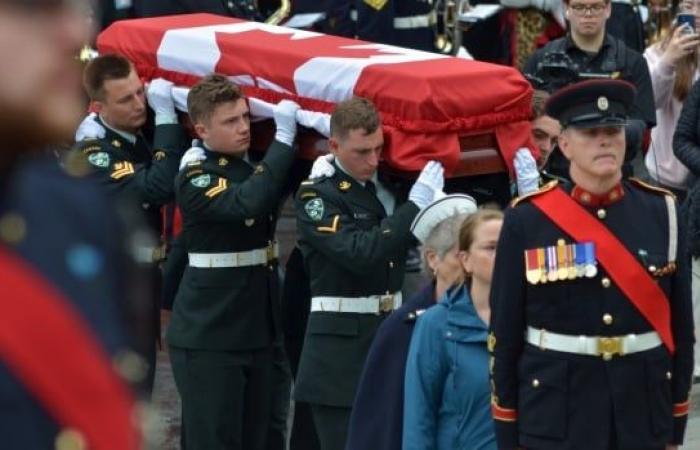 Under grey skies and rain, N.L. entombs its Unknown Soldier in solemn ceremony at war memorial