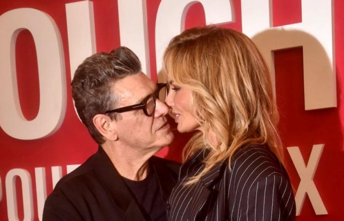 Adriana Karembeu and Marc Lavoine kiss on the red carpet