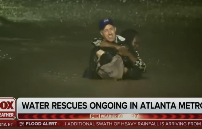 journalist Bob van Dillen rescues a woman trapped in the water live