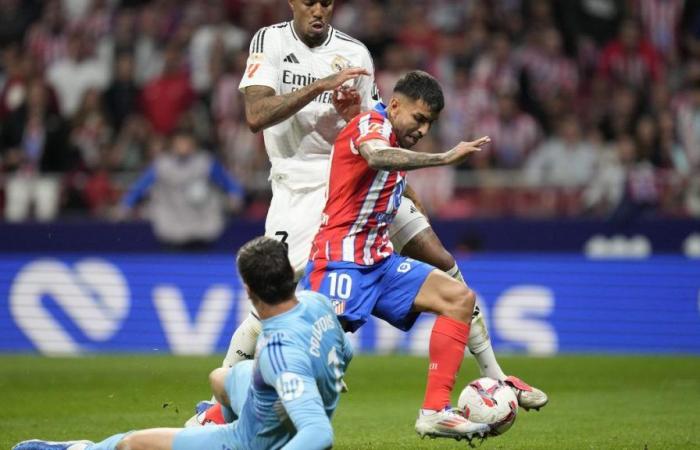 Real Madrid draws against Atletico in derby interrupted after objects thrown on the field