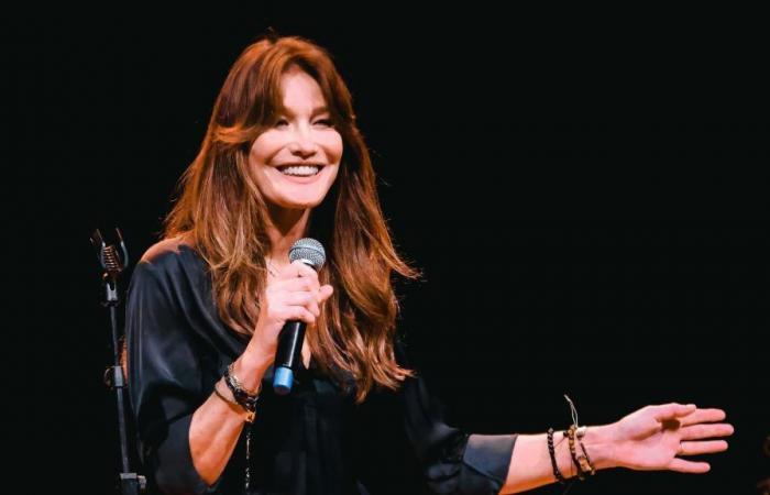 Carla Bruni shows off her legs in an immaculate coat at Fashion Week