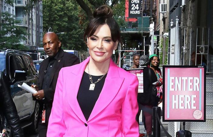 Back on Broadway, Alyssa Milano appears in a chic hot pink ensemble