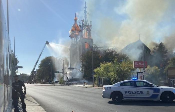 The Notre-Dame-des-Sept-Allégresses church is engulfed in flames