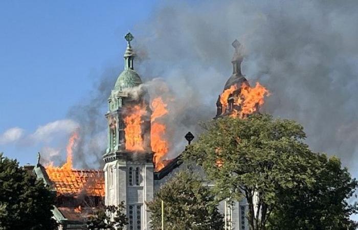 The Notre-Dame-des-Sept-Allégresses church is engulfed in flames