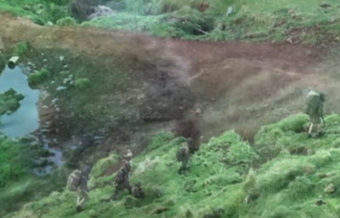 A father and his three children spotted in camouflage clothing in the wilderness, three years after their disappearance