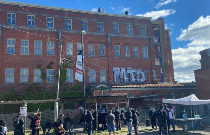 Activists storm an empty building in the name of access to housing