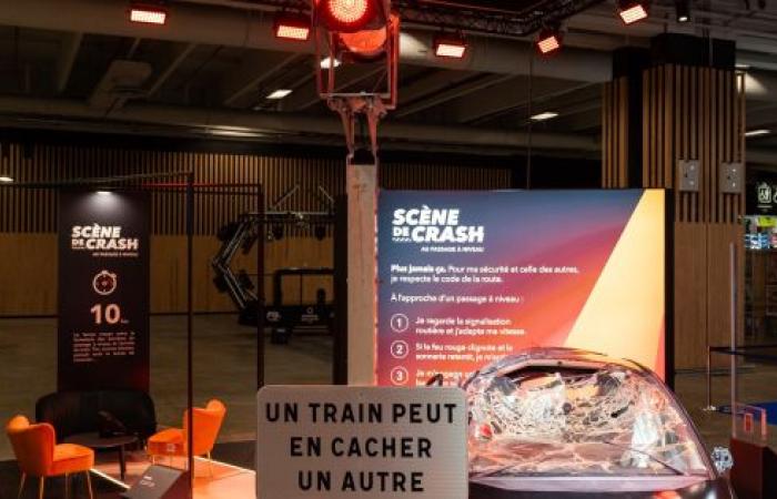 A damaged car on display at the Paris Motor Show