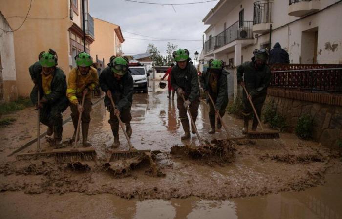 Faced with floods in Spain, stunned residents and overwhelmed emergency services