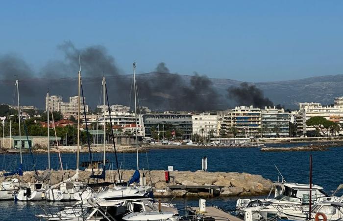 A fire breaks out on the roof of a building in downtown Antibes