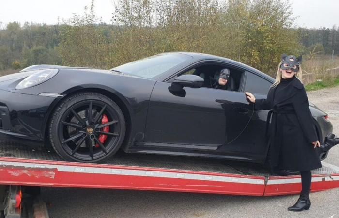 Arrested for speeding, Batman poses for the police