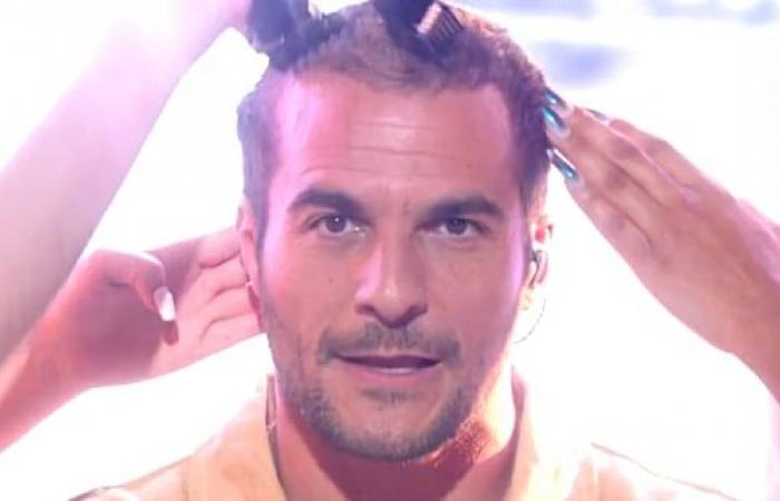 Amir shaves his head during performance at the NRJ Music Awards