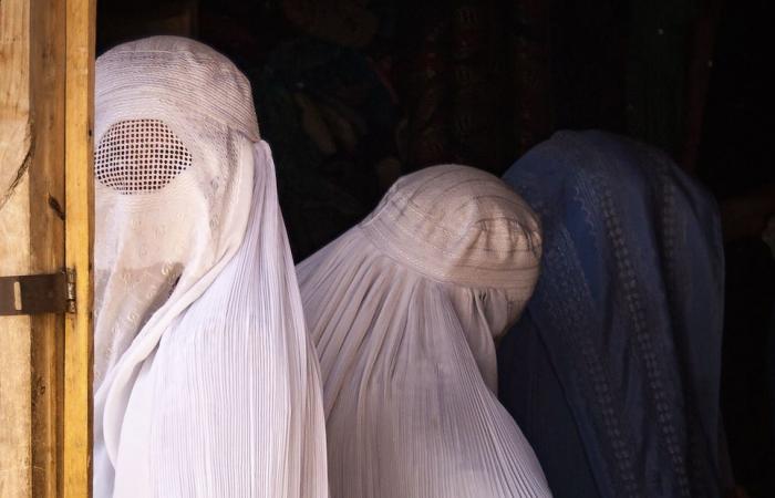 women banned from speaking to each other by the Taliban